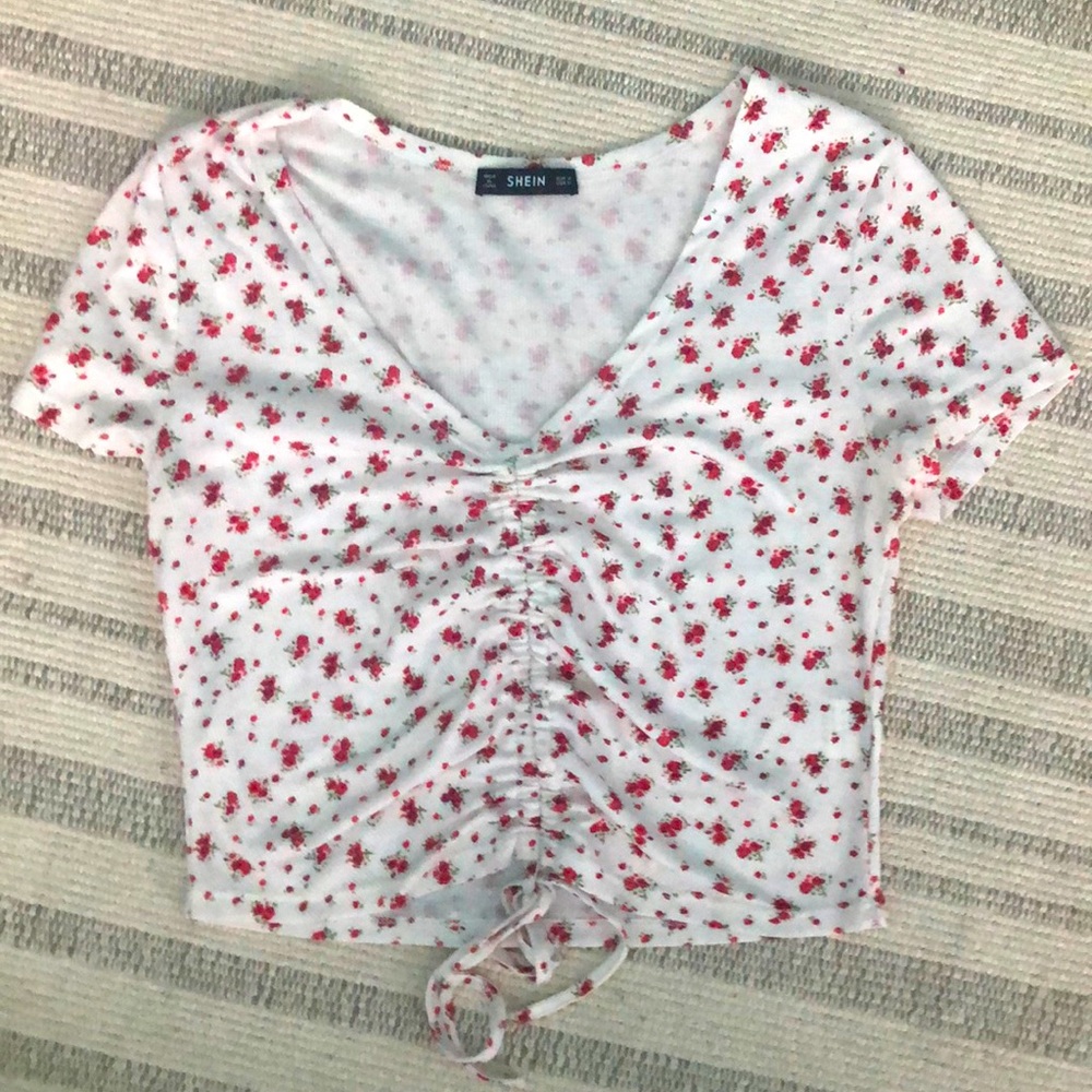 Pink floral top with a bunchy middle and tie